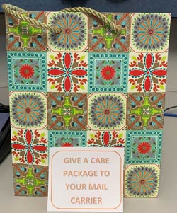 Decorative bag to use to Give a Care Package to Your Mail Carrier for Random Act of Kindness Day.