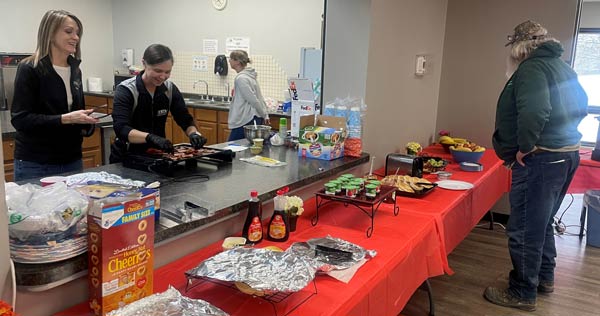 Man looking over the breakfast buffet options.