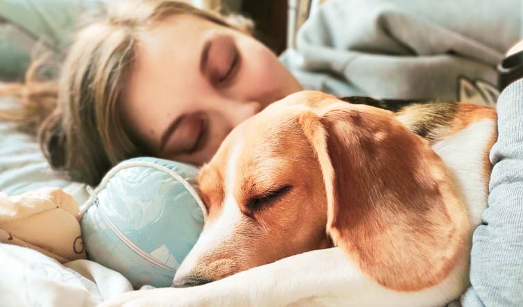 Woman and dog relaxing together.