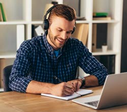 Man with headphones in an online meeting.