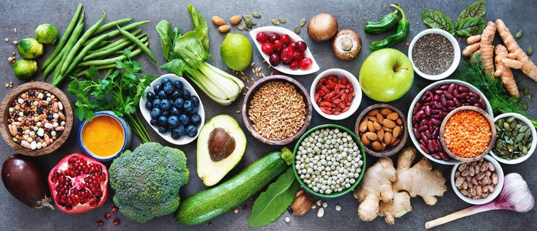 Display of fruits, vegetables and nuts on a table.