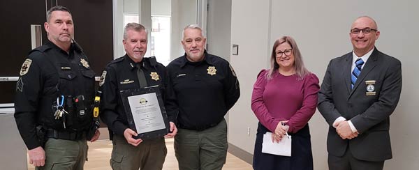 Group shot of ILEAP execs and Naperville Park District Police Department execs after receiving ILEAP certification.