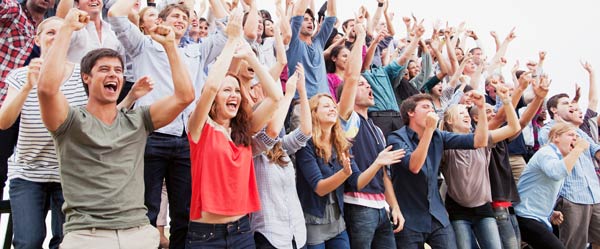 Cheering crowd of adults.