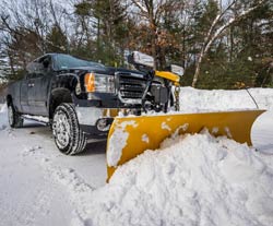 Pick-up with a snowplow attached.