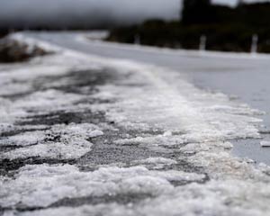Snow/ice on the roadside.